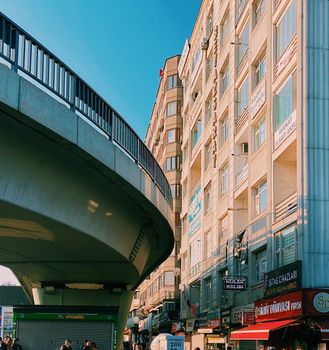 Cityscape of Ankara showcasing an overpass and high-rise buildings under clear blue skies.