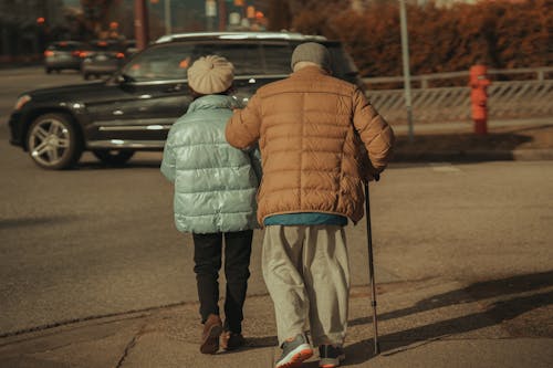 Elderly Man and Woman on Sidewalk