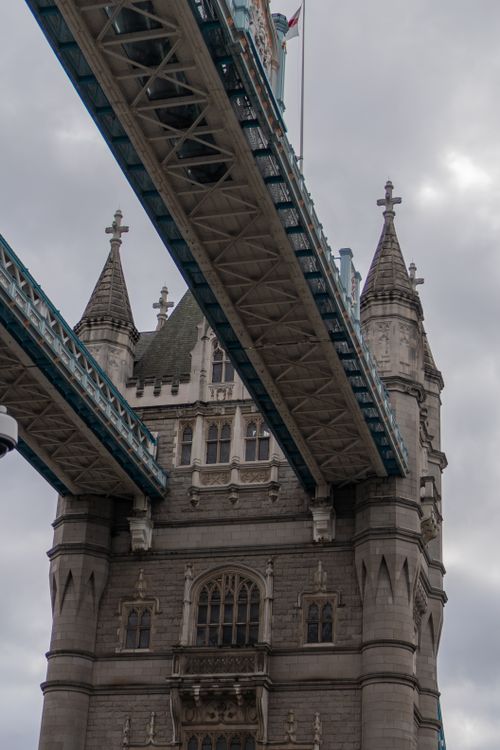 Free View of Tower Bridge against an overcast sky highlighting its gothic architecture. Stock Photo