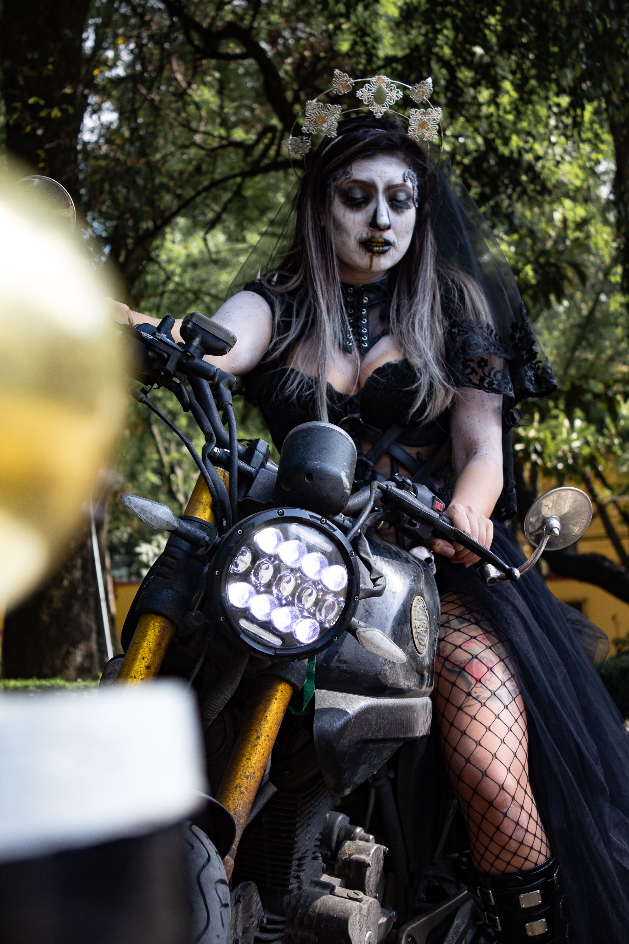 A Woman in a Goth Costume on a Motorbike · Free Stock Photo