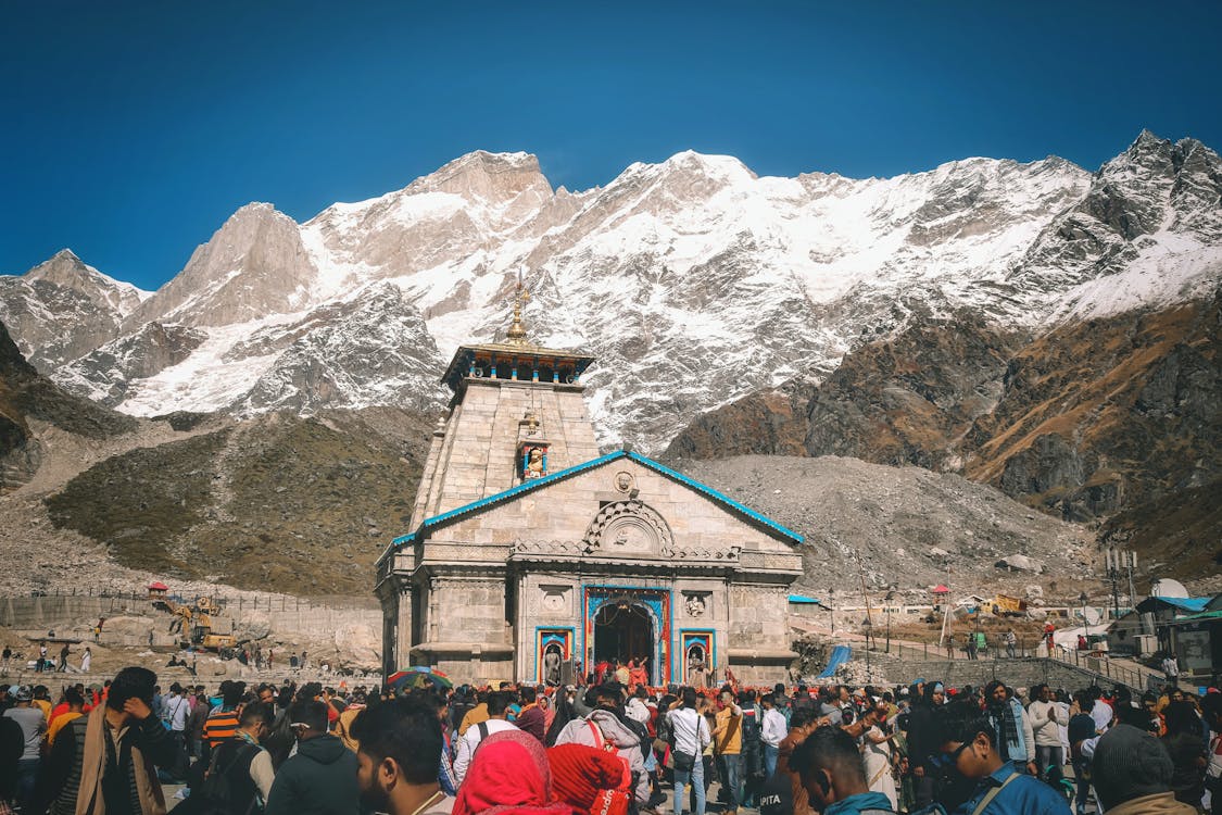 Crowds of People by a Mountain Temple