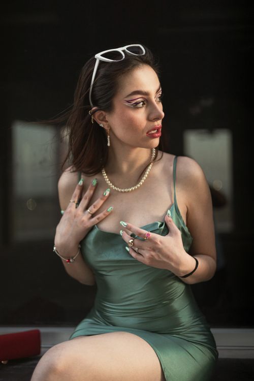 A woman in a green dress and glasses Free Stock Photo A woman in a green dress and glasses Free Stock Photo