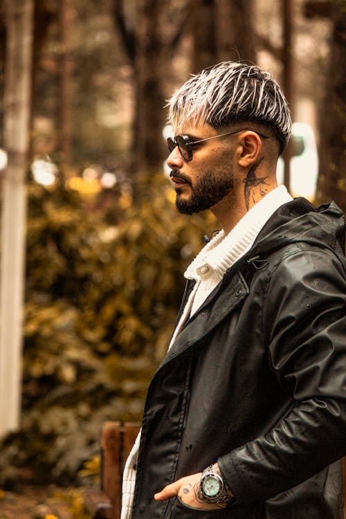 Man with Dyed Hair Posing in Black Jacket