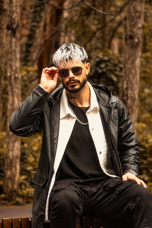 Man Posing in Sunglasses and Black Jacket