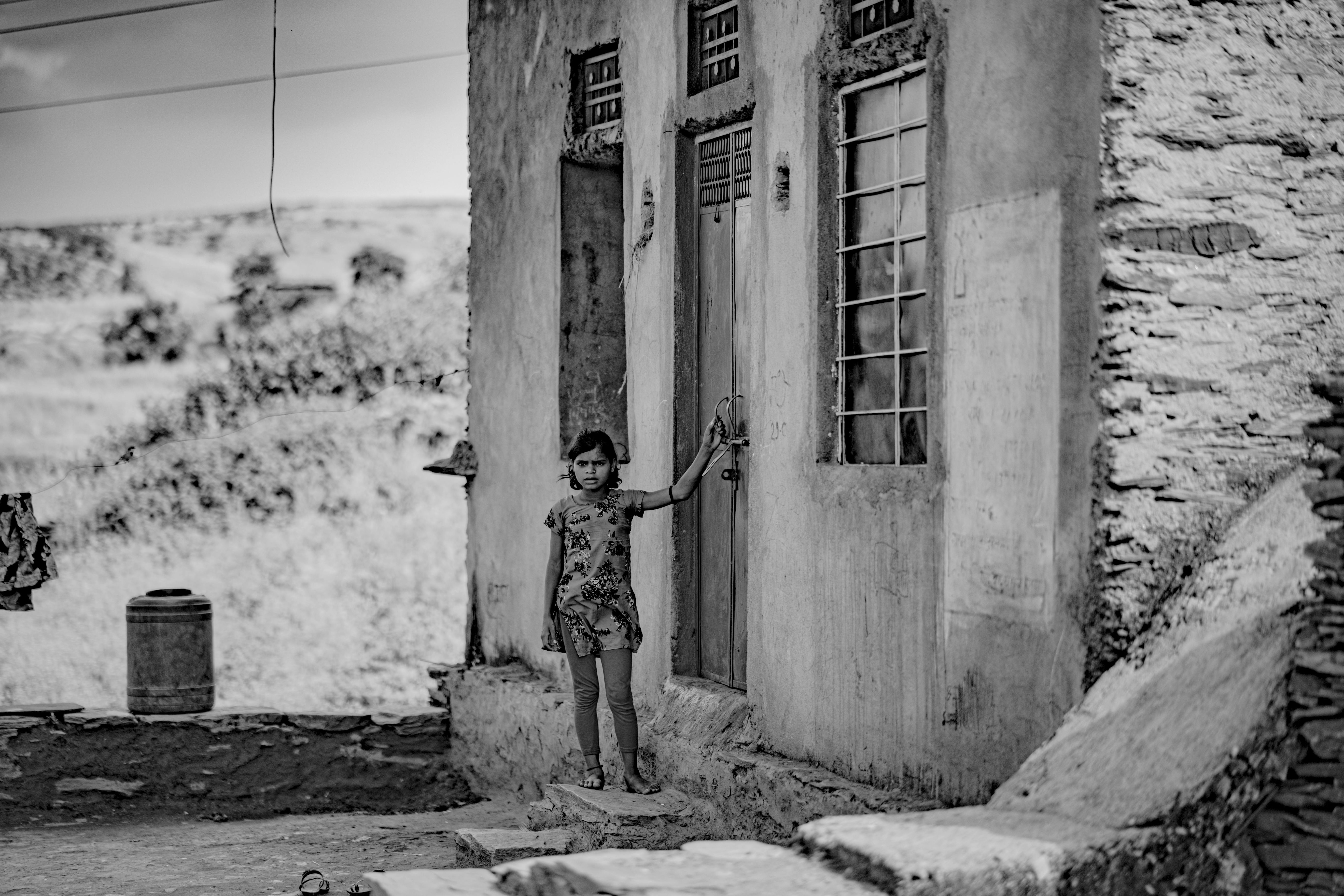 LITTLE GIRL STANDING IN THE DOORWAY TYPICAL NEPALESE BRASS-STUDDED DOOR  NEPAL - Stock Photo - Masterfile - Rights-Managed, Artist: ClassicStock,  Code: 846-03165705