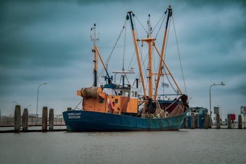 Ship with Masts in a Dock