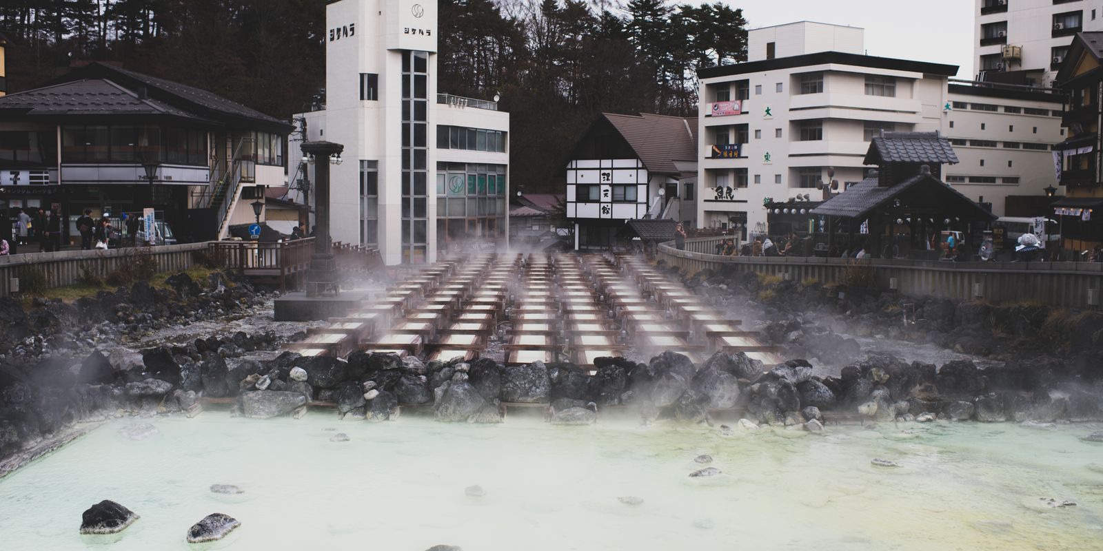 Steam rising from warm mineral springs in a historic spa town