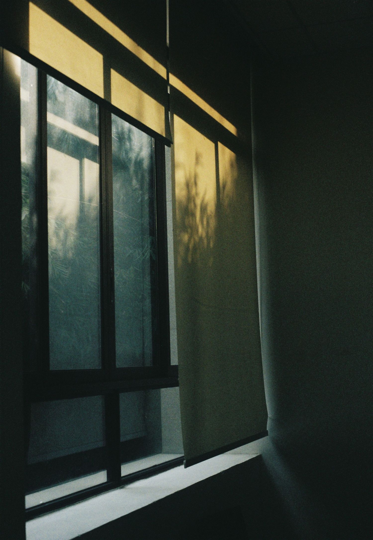 Warm light through roller blinds