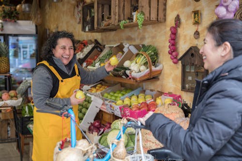 Woman Buying Food at the Greengrocers