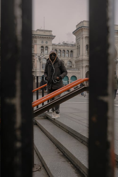 Man in Jacket Posing on Stairs