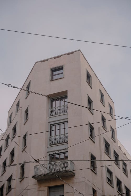 Free Low Angle Shot of a Residential Building with Balconies in City  Stock Photo