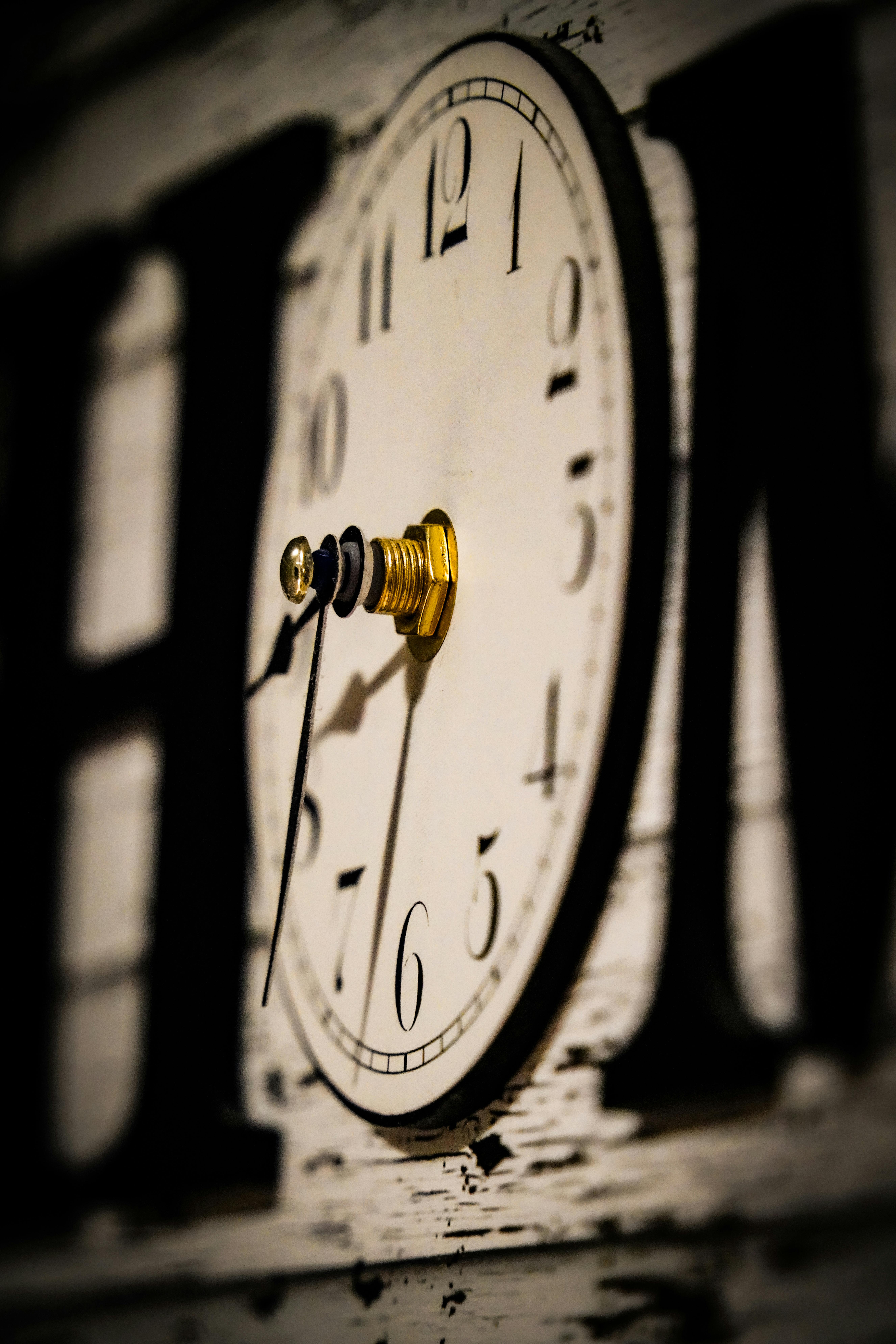 Close-up of an antique clock face with intricate details.