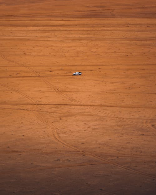 Car on Barren Desert