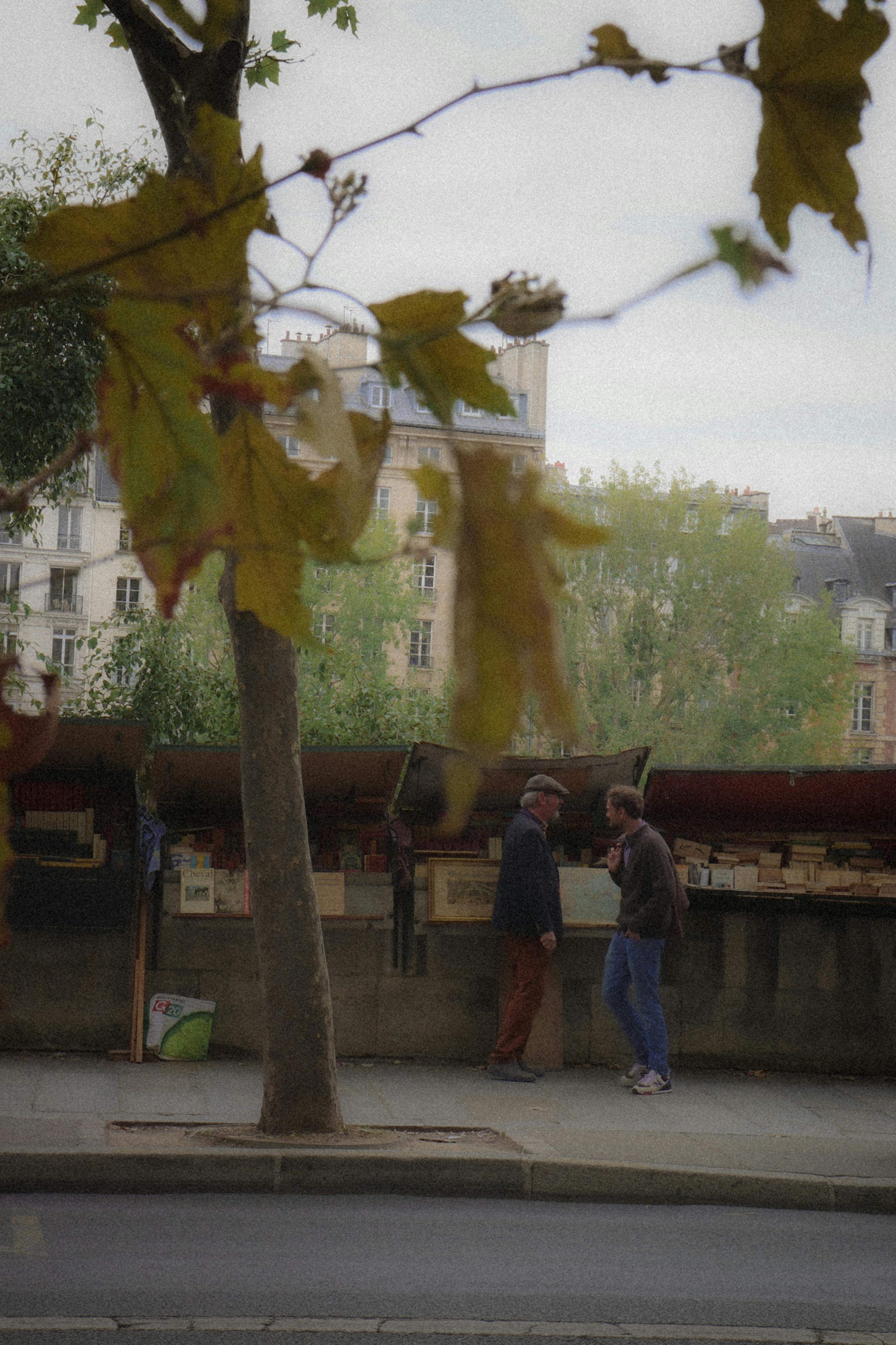 a man is walking down the street with a dog