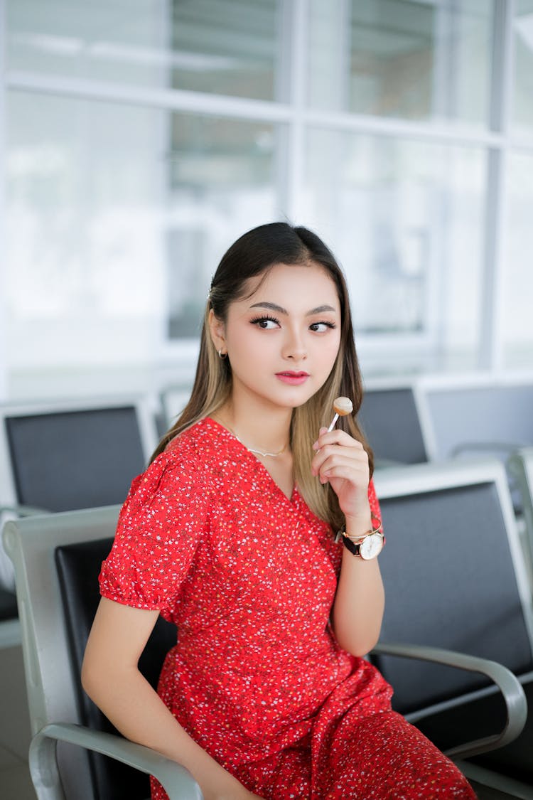 Woman With Lollypop At Airport