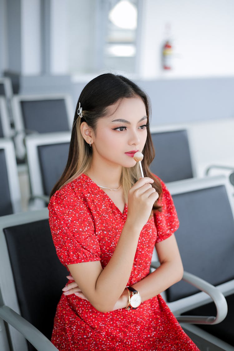 Woman With Lollypop At Airport