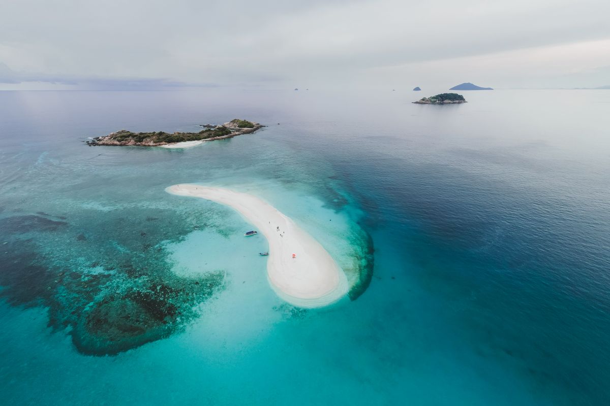 Aerial view of tropical islands and a sandbar — photo by Pok Rie on Pexels