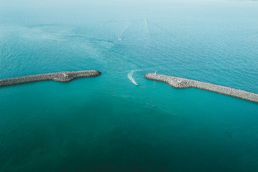 Aerial View of Two Promontories and a Ship
