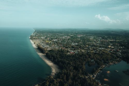 Free A striking aerial view of a coastal peninsula and seascape under a clear summer sky. Stock Photo