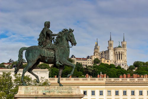Equestrian Statue of Louis XIV and Basilique Notre-Dame de Fourviere, Lyon, France