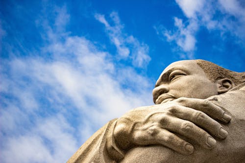Close-up of Granite Sculpture of Martin Luther King Jr Against Blue Sky