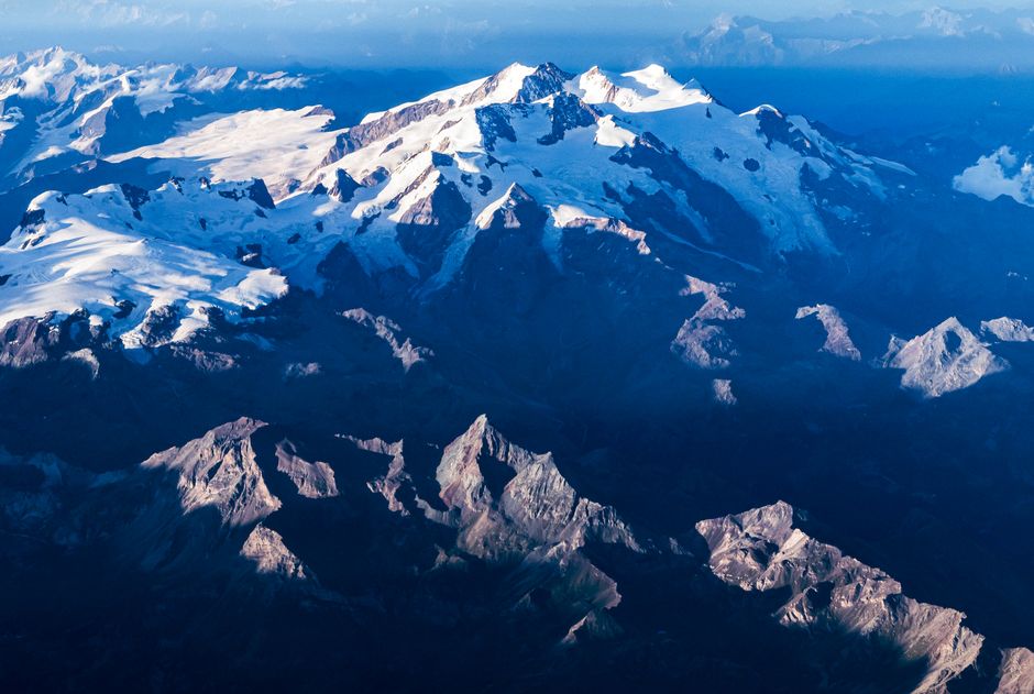 Bear Glacier Signature Helicopter Tour - Stunning aerial photography capturing snow-covered mountain peaks under a bright blue sky.