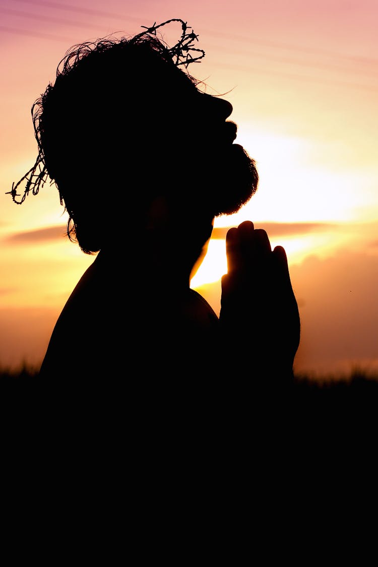 Silhouette Image Of Person Praying