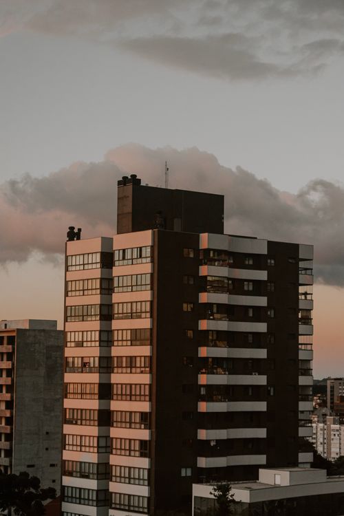 Free High-rise buildings in an urban setting under twilight sky, showcasing modern architecture. Stock Photo