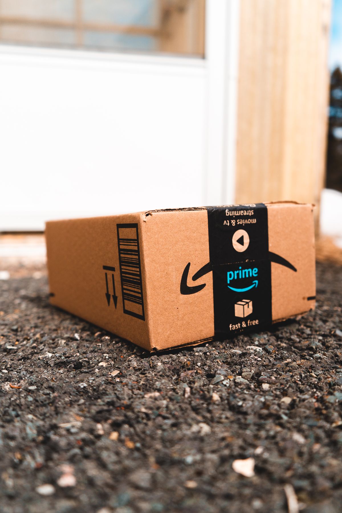 Package from Amazon Prime Carried by the Delivery Man · Free Stock Photo
