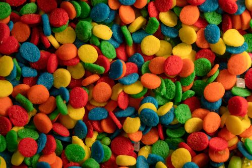 Free Colorful close-up of sugar sprinkles perfect for adding fun to food photography. Stock Photo