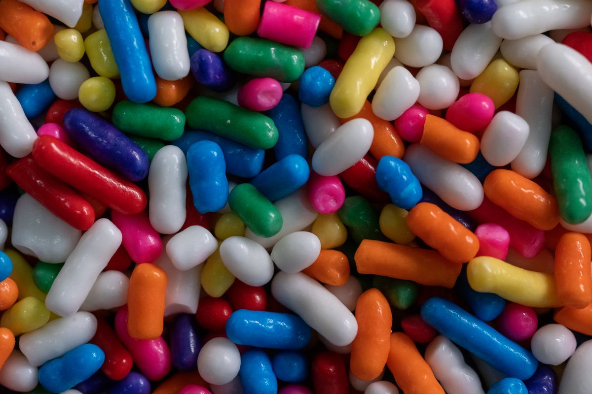 A vibrant array of colorful candy pieces in various shapes and colors, perfect for sweets lovers.