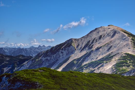 Breathtaking view of rugged mountains under a clear blue sky in Bosnia.