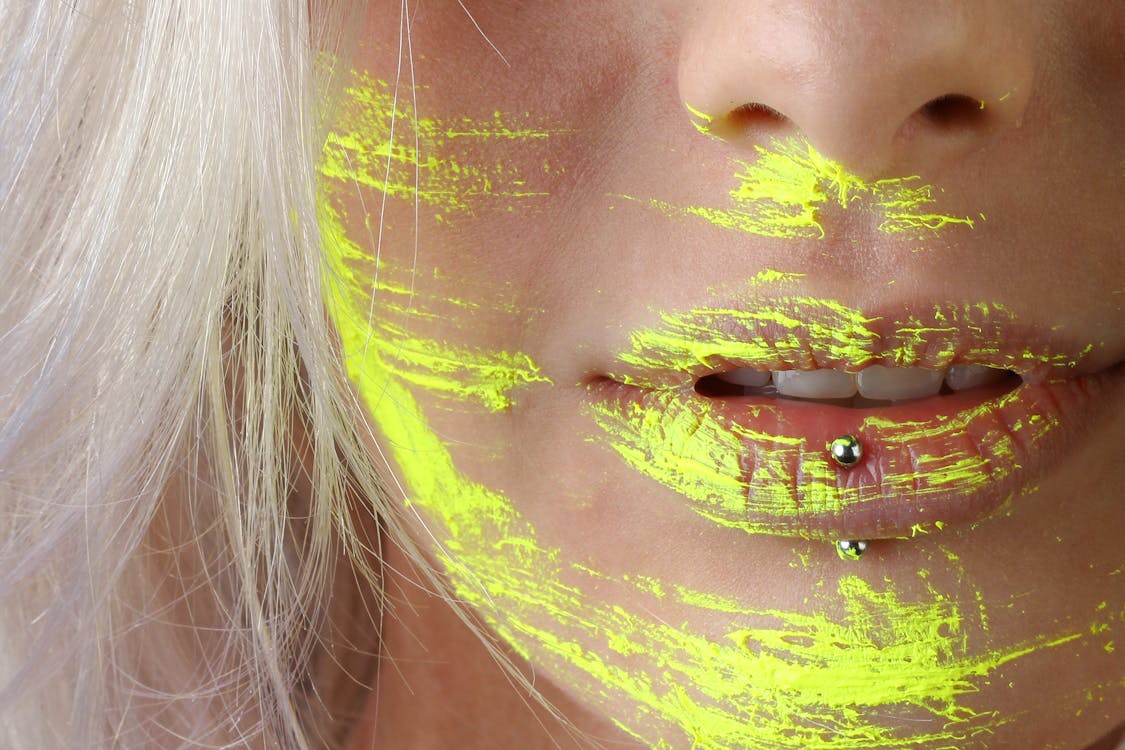 Free Woman With Yellow Paint On The Face Stock Photo