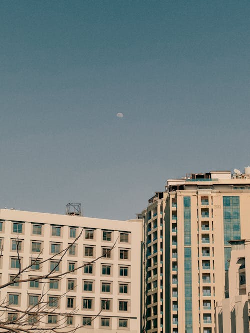 Moon on Blue Sky over Buildings