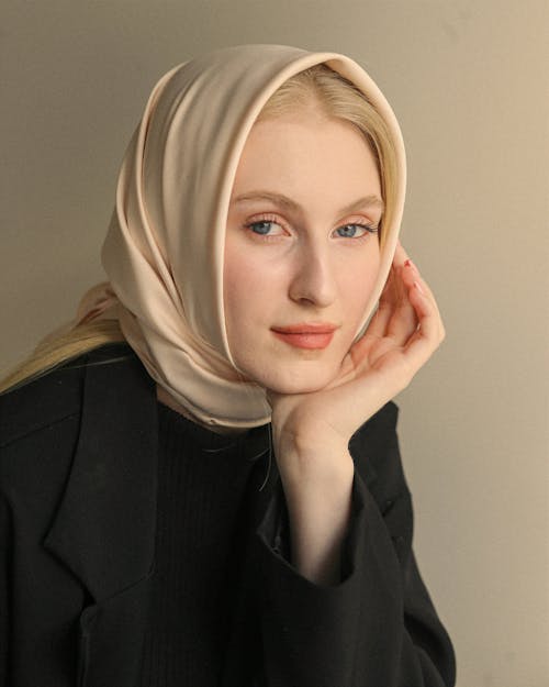 Portrait of a Blond Woman Wearing a Headscarf