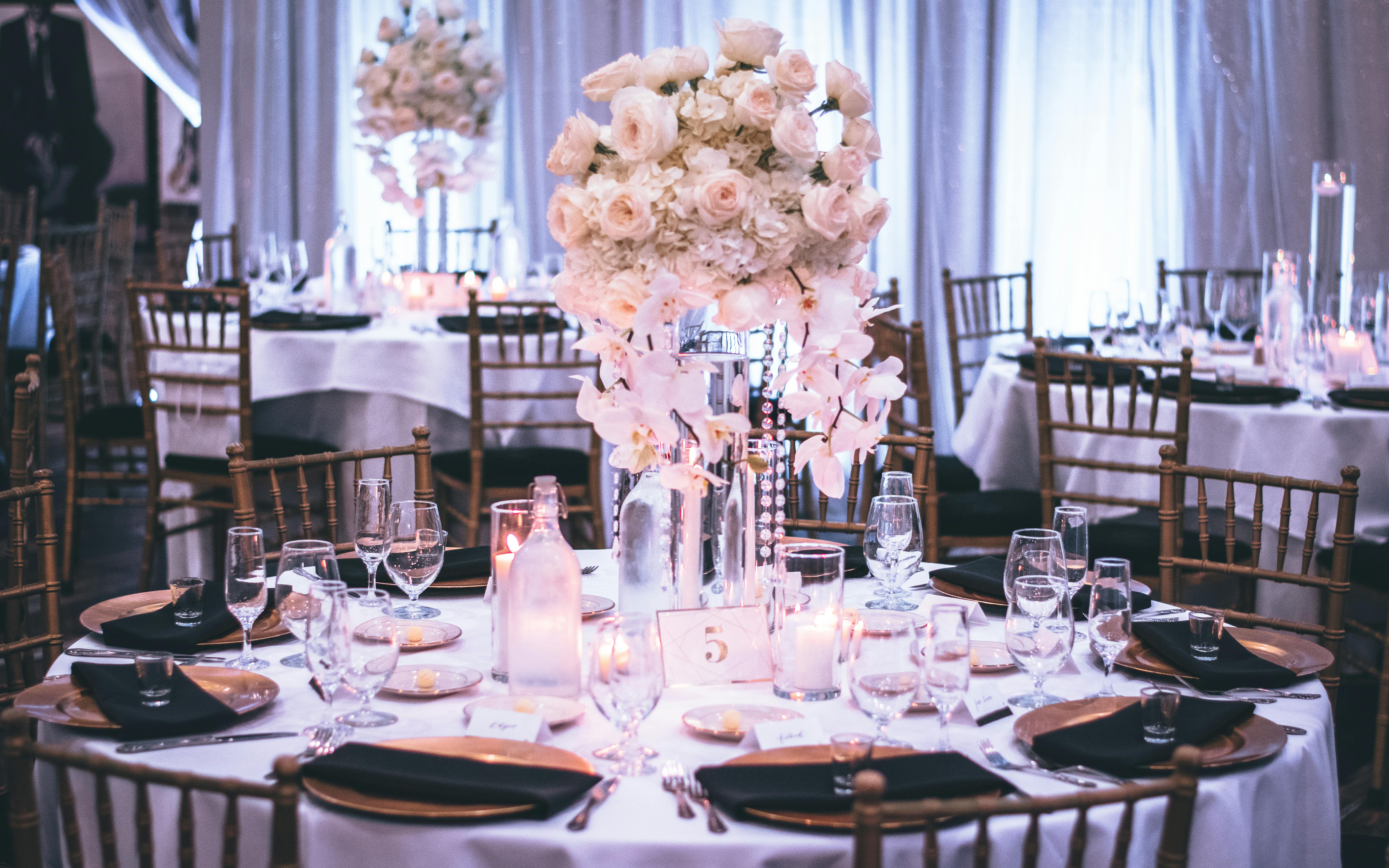 Pink and White Roses Centerpiece on Top of Table