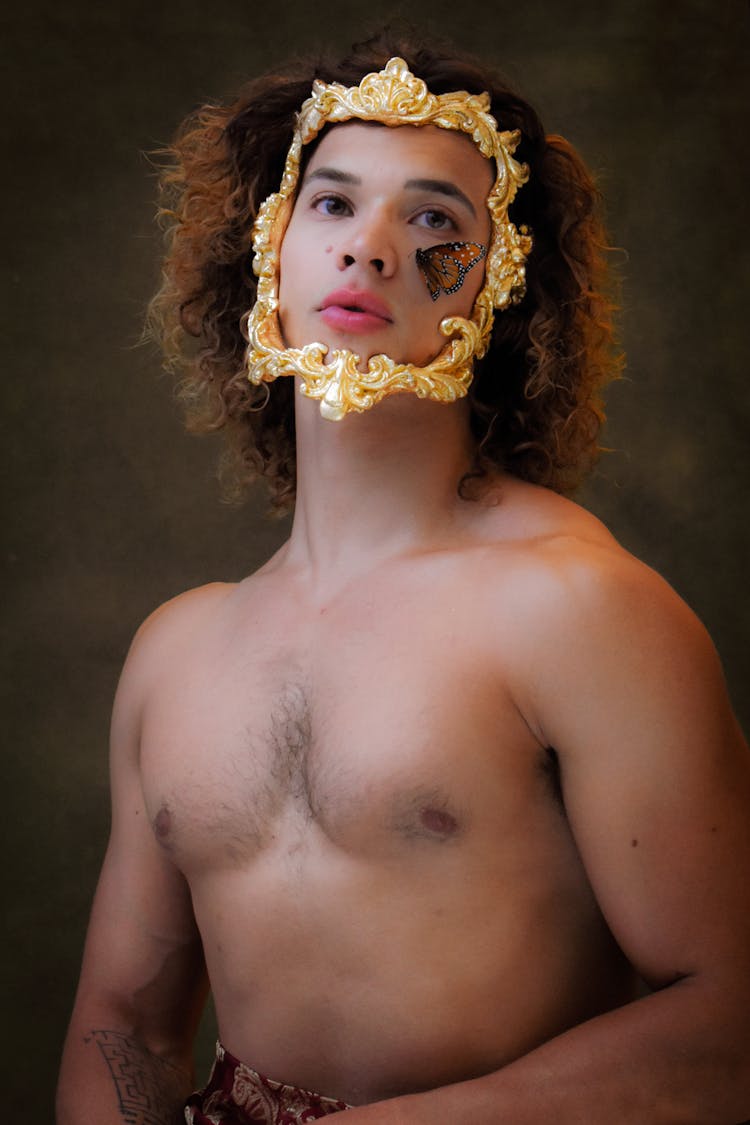 Shirtless Young Man With Golden Face Mask