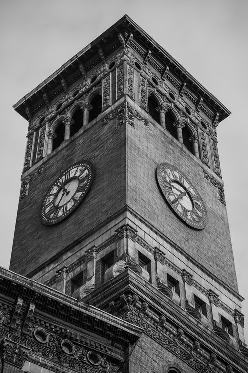 Free Black and white photo of a historic clock tower showcasing detailed architecture. Stock Photo