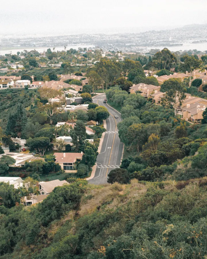 Refrigerator repair service areas in San Diego County Winding road through greenery and suburban homes in San Diego, California, part of our refrigerator repair service area