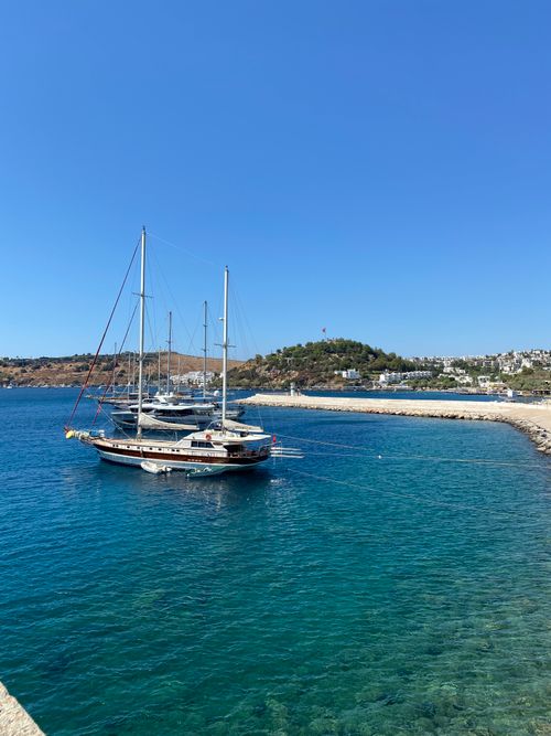 Free Stunning view of luxury yachts moored in a clear blue harbor, perfect for a summer getaway. Stock Photo