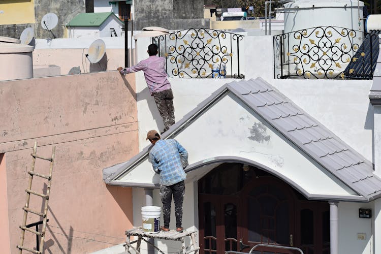 Workers On Roof