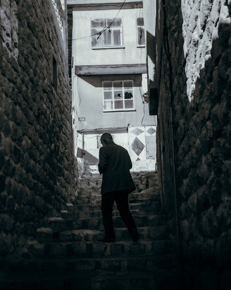 Man On Steps In Old Town