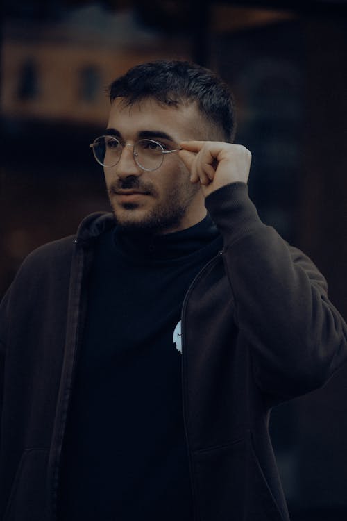 Free A Man Touching his Spectacles Stock Photo