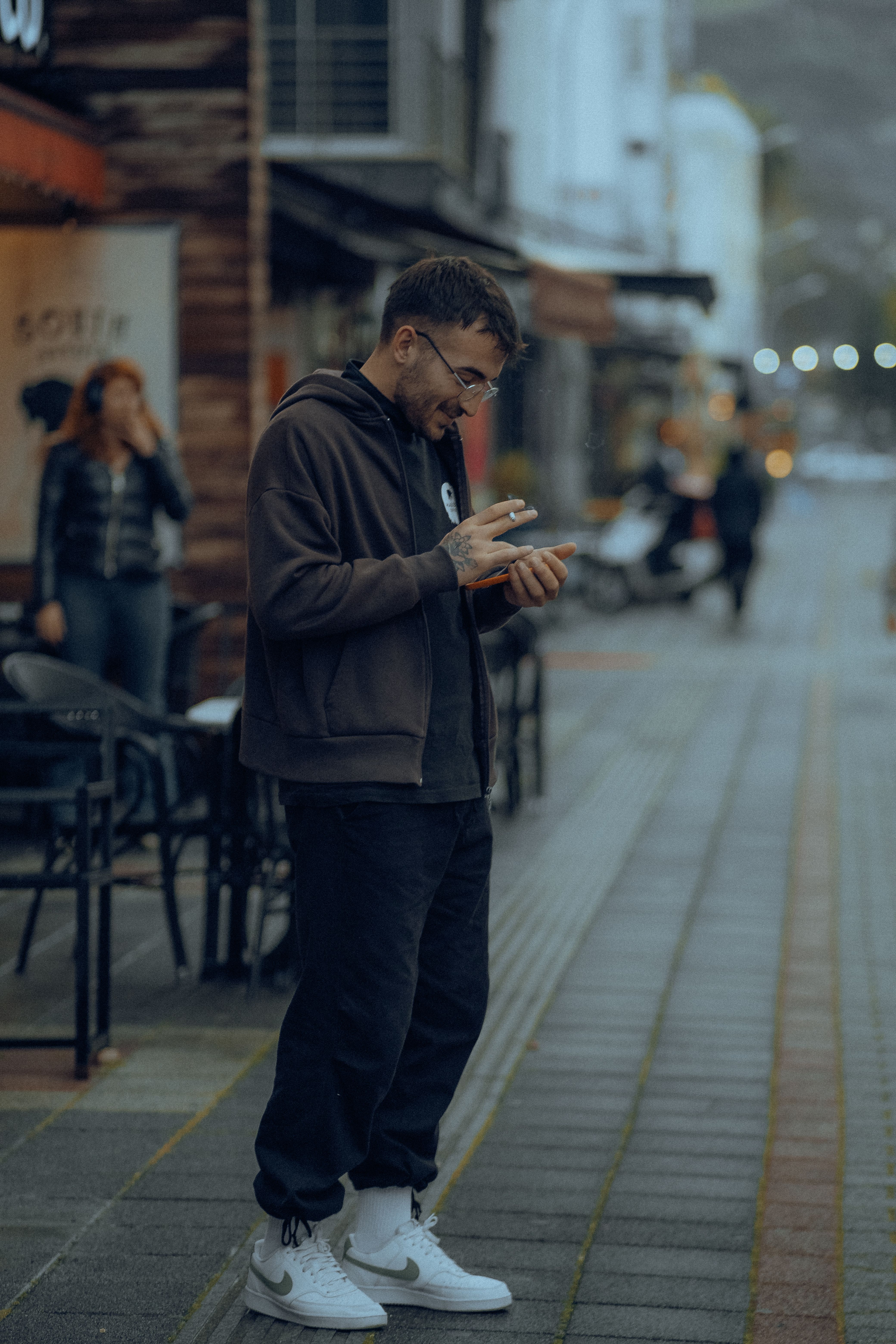 Standing on Street Man Using a Smart Phone · Free Stock Photo