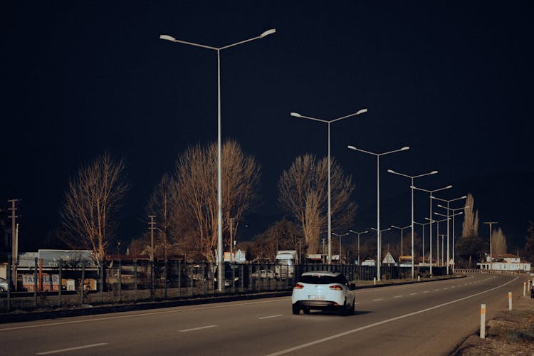 Car Running On Night Urban Street