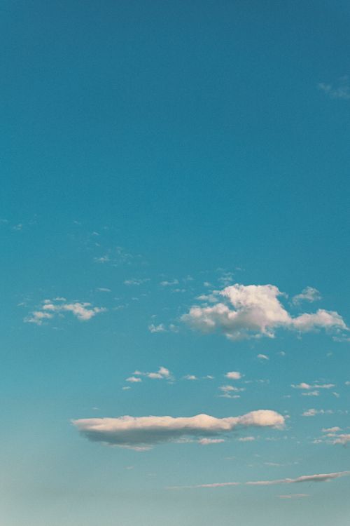 Serene Blue Sky with Fluffy White Clouds · Free Stock Photo
