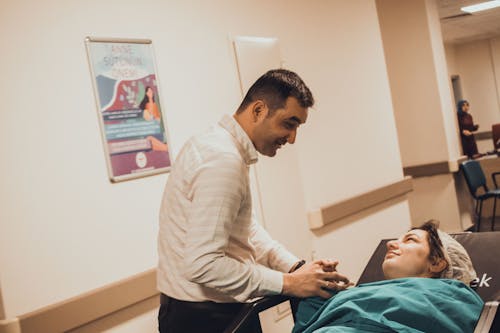 Man Supporting Woman Before Giving Birth