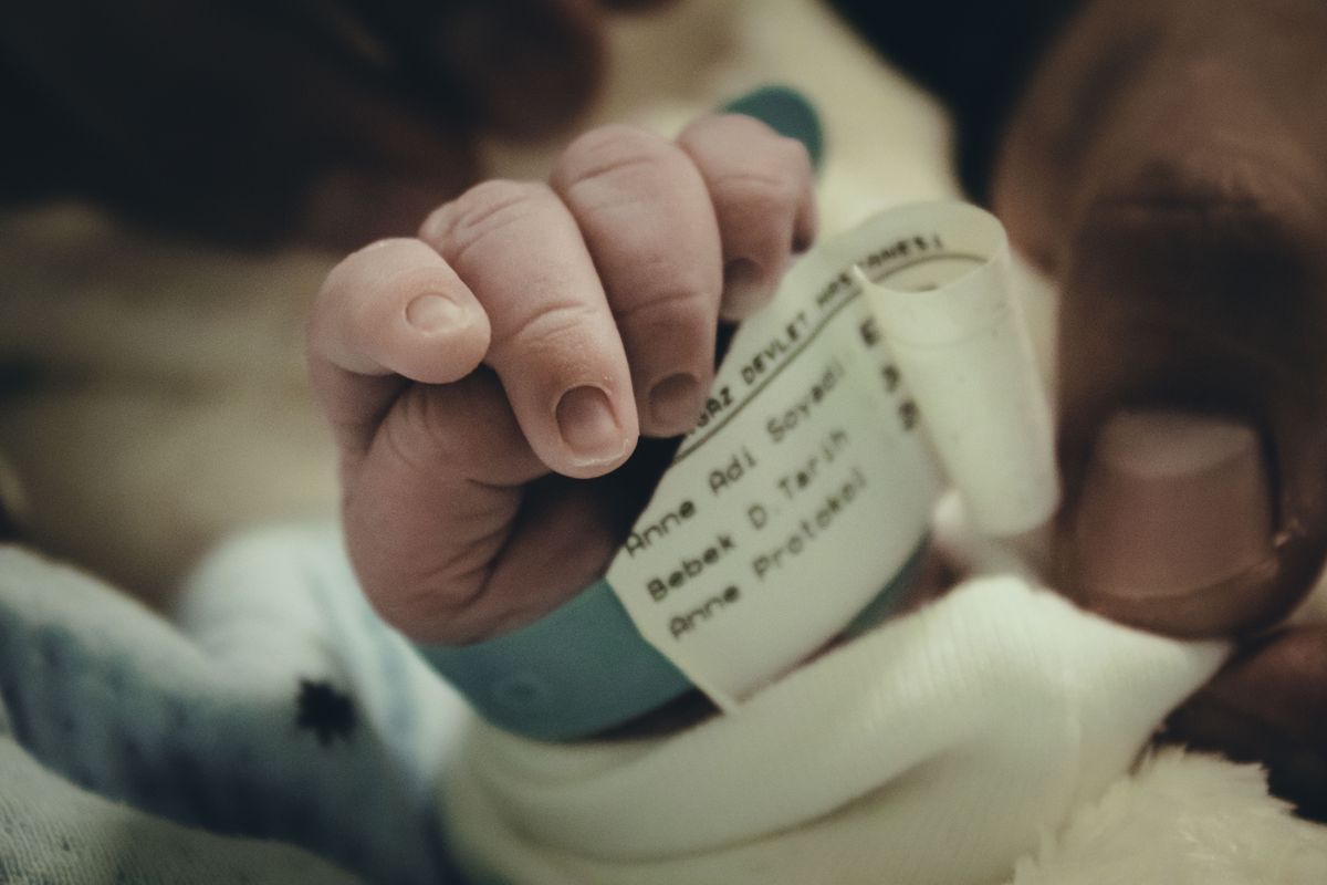 Hospital ID band on a newborn wrist