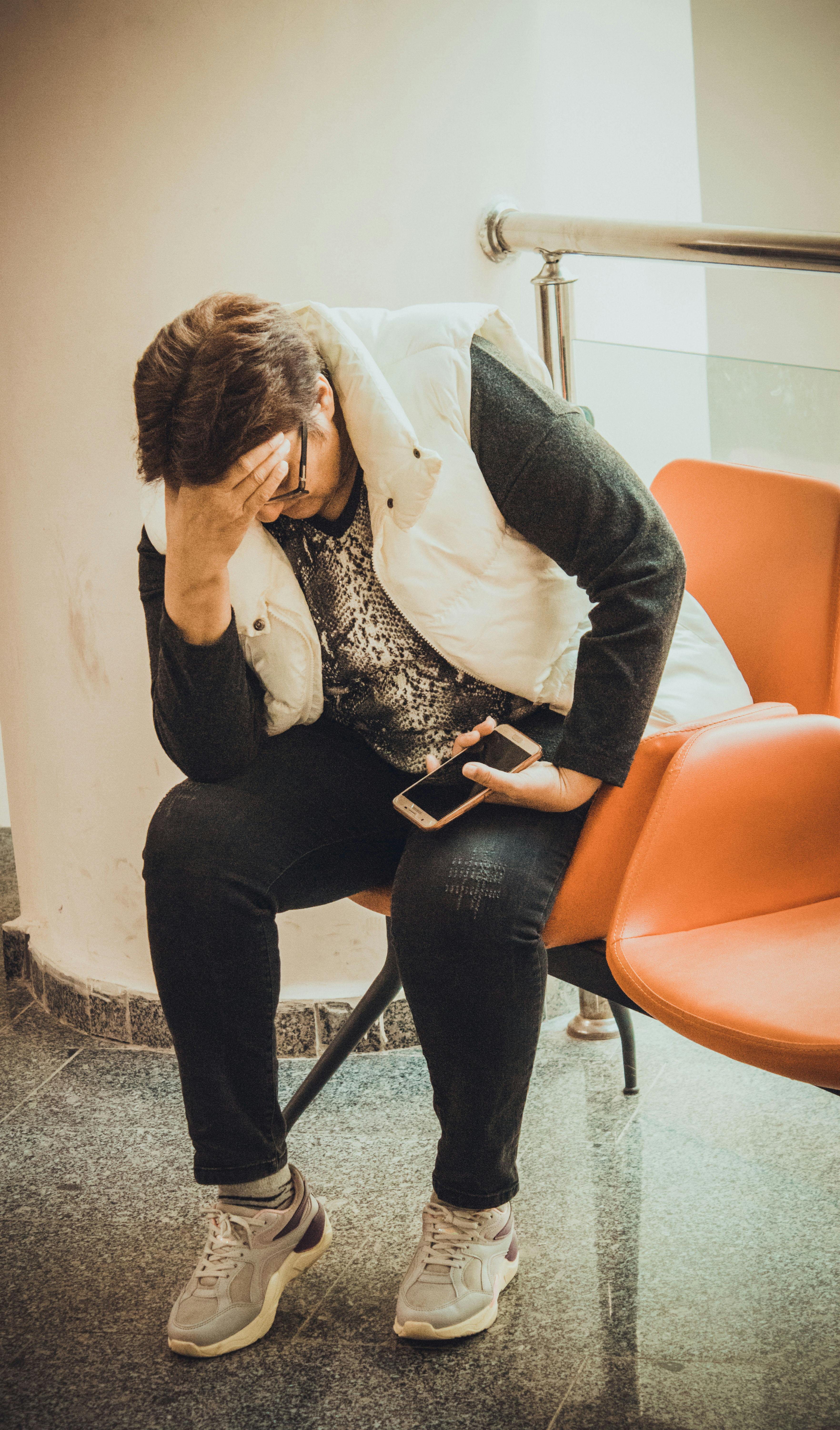 worried woman sitting in waiting room