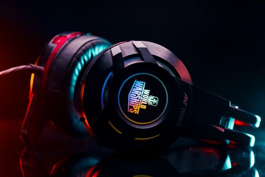 Close-up of a vibrant gaming headset with LED lighting, perfect for gamers.